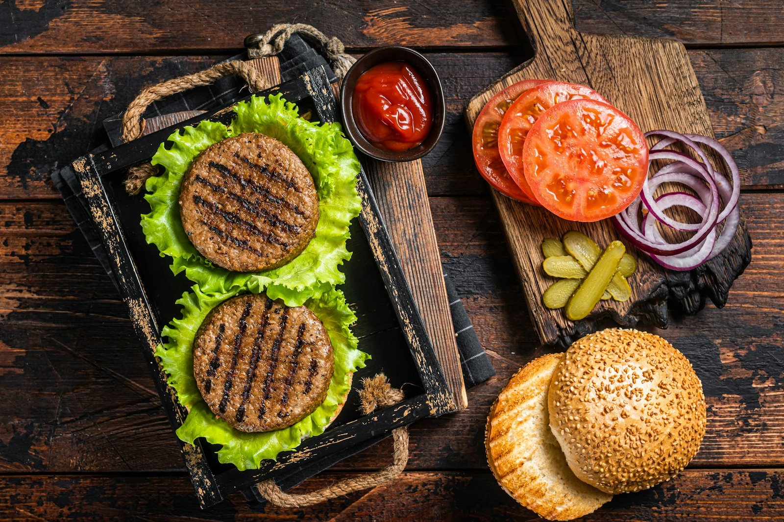 Cooking Plant based meatless burgers with vegetarian meat free roasted cutlets, patties, tomato