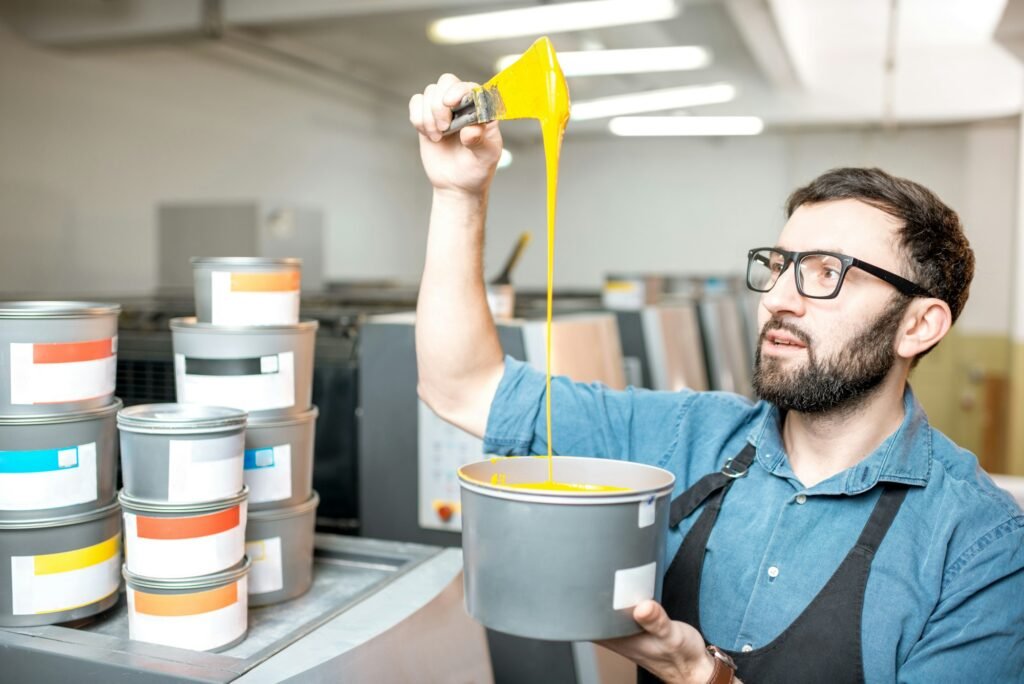 Typographer with paint at the manufacturing