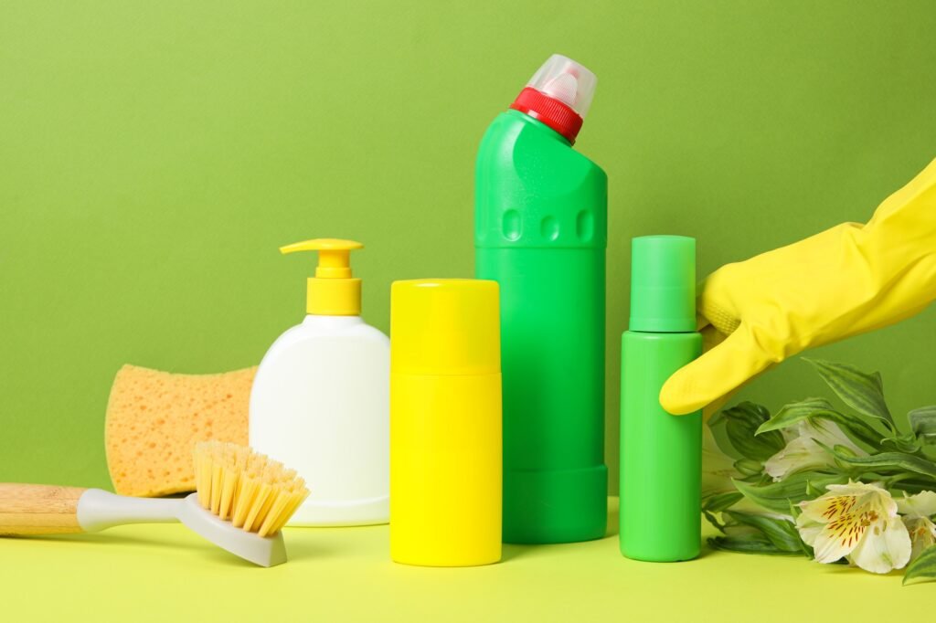 Detergents and a washcloth with fresh flowers